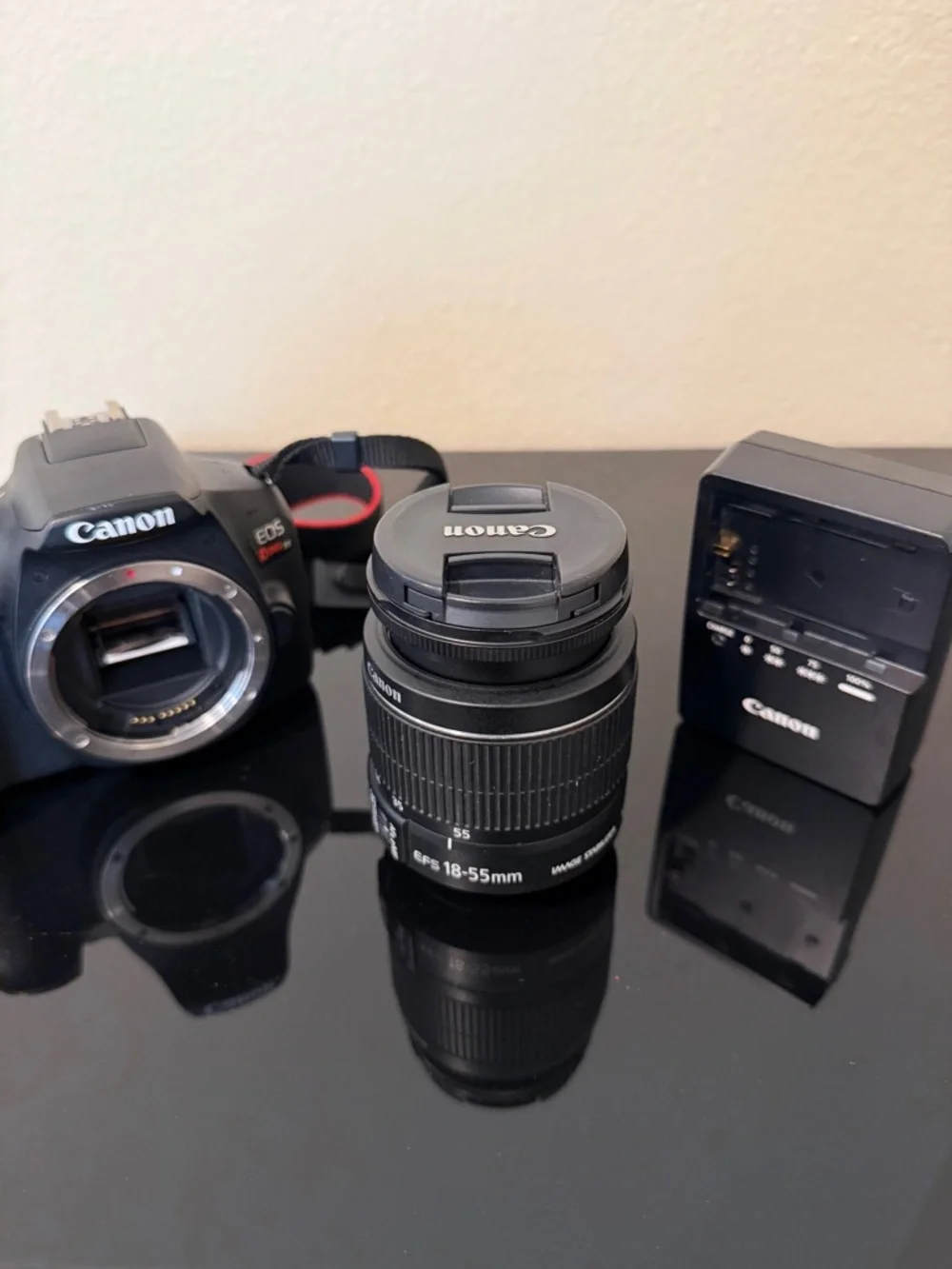 Canon DSLR Camera Body with Black 18-55mm Lens and Black Charger